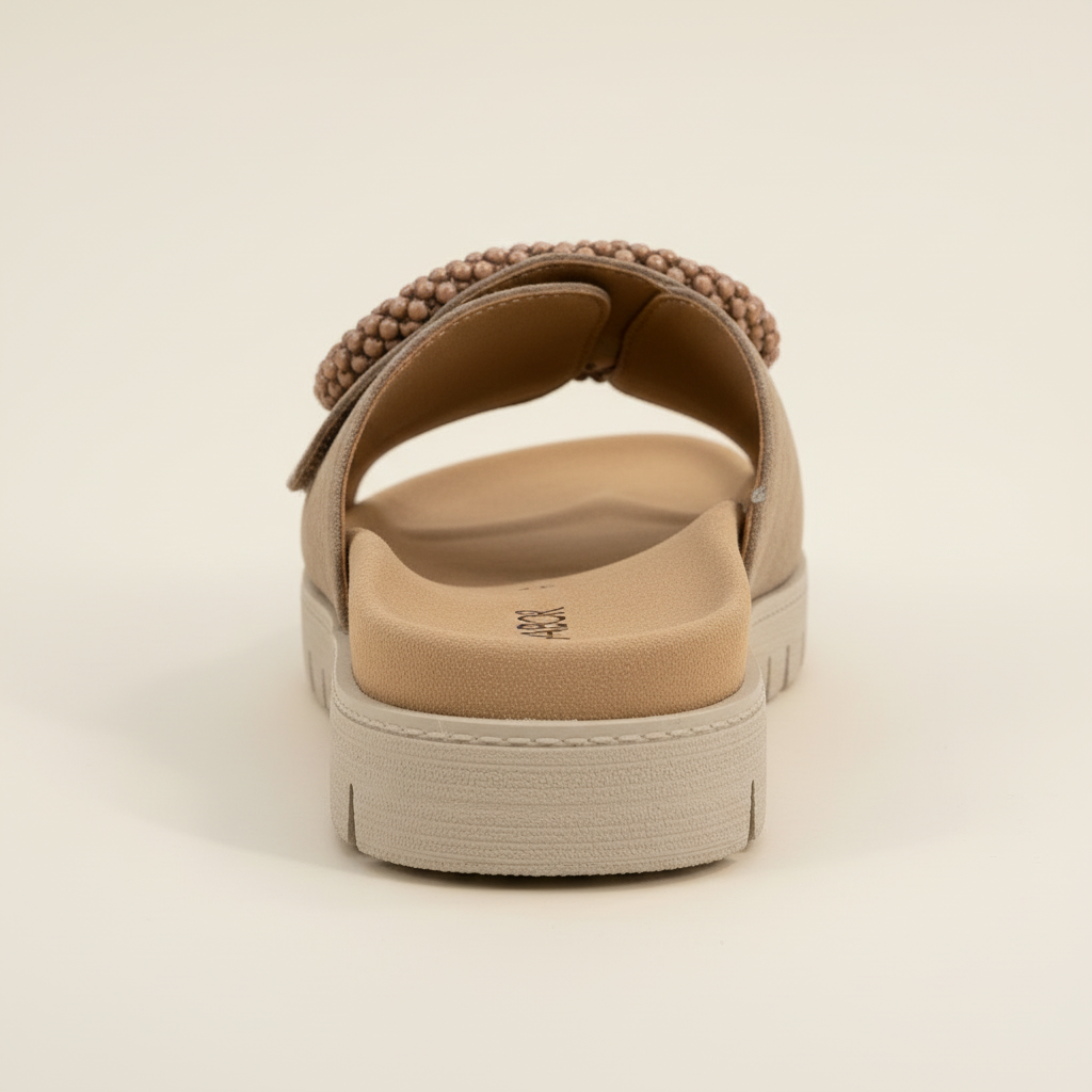 Beige sandal with a platform sole on a beige background