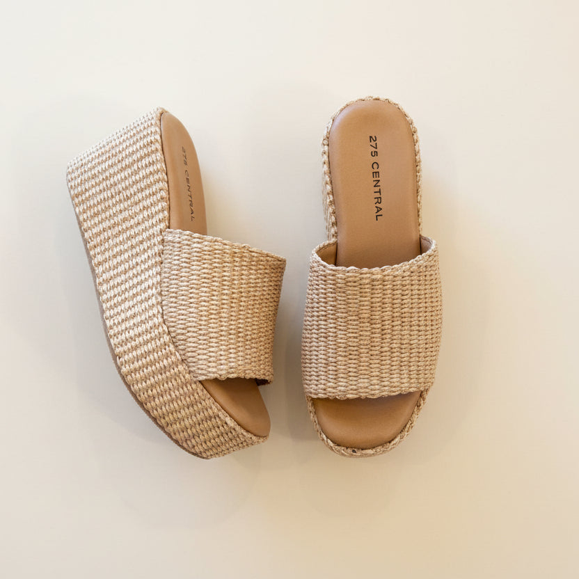Pair of woven sandals on a light background
