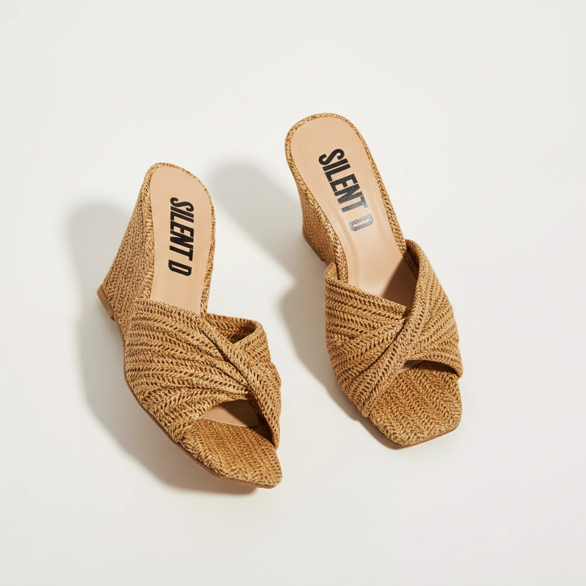 Pair of woven sandals with 'SILENT-D' branding on a light background