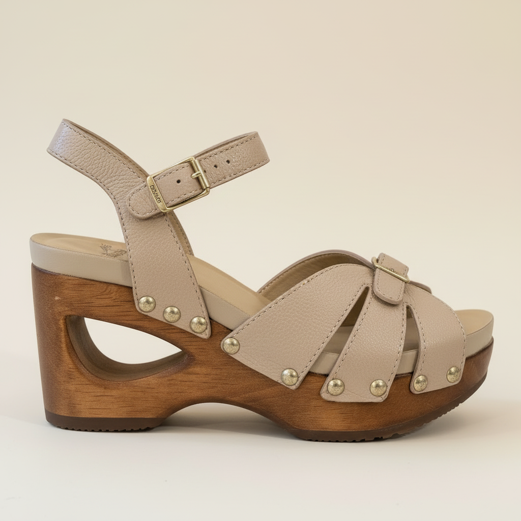 Beige sandal with wooden sole on a beige background