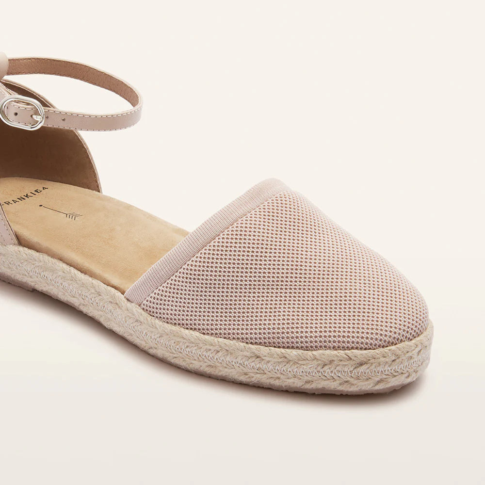 Pink espadrille sandal on a light background