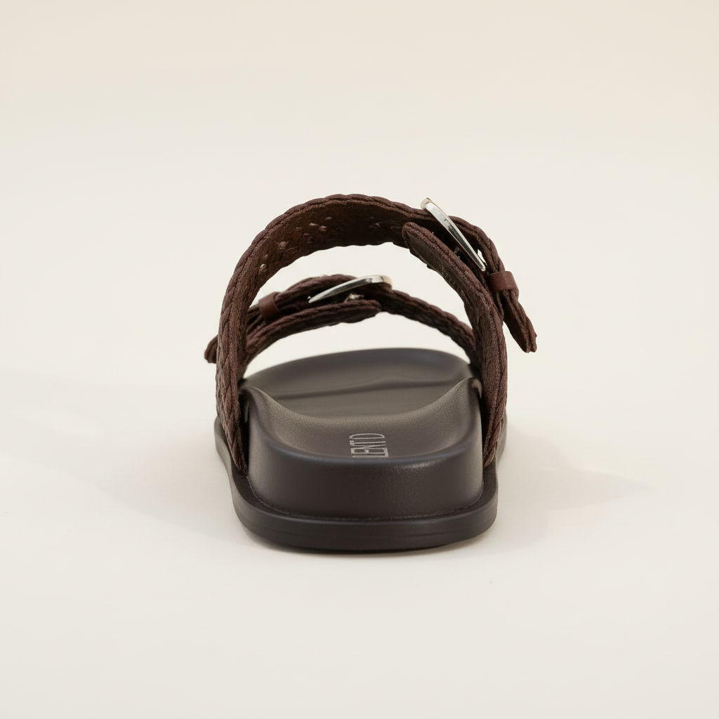 Brown sandal with a black sole on a white background