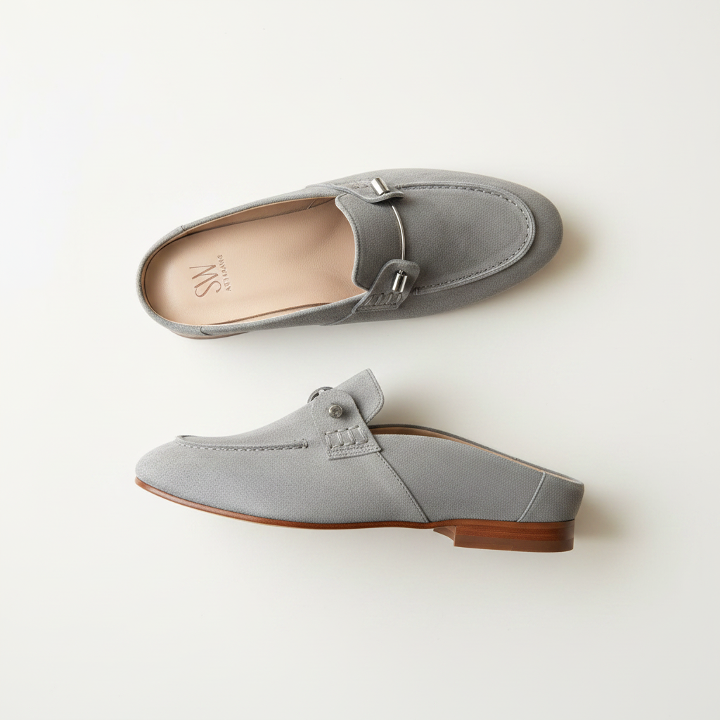 Gray loafers with wooden soles on a light beige background